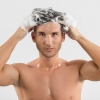 Man washing his hair in 3DHair shampoo.